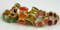 9 stone rings in 18k gold and various stones.